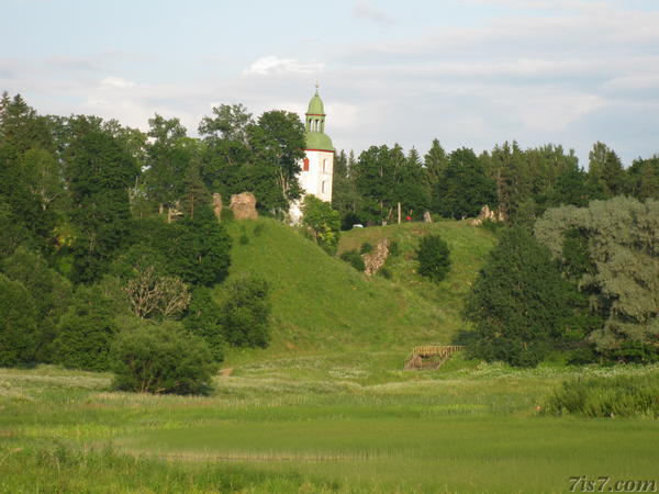 Ruins and church seen accross the valley