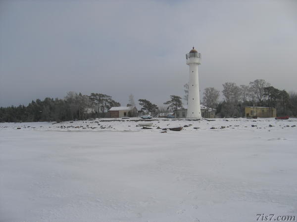 Saxby Lighthouse seen from the frozen sea